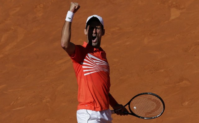 novak-djokovic-celebrates-beating-dominic-thiem-at-madrid-open-2019-images